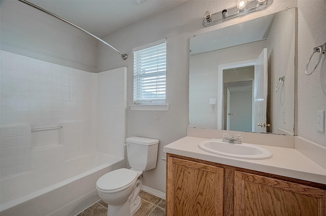 full bathroom featuring vanity, tile patterned floors, bathing tub / shower combination, and toilet