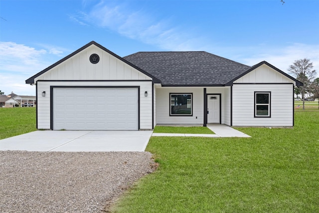 view of front of home featuring a garage and a front yard