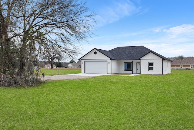 view of front facade with a garage and a front yard