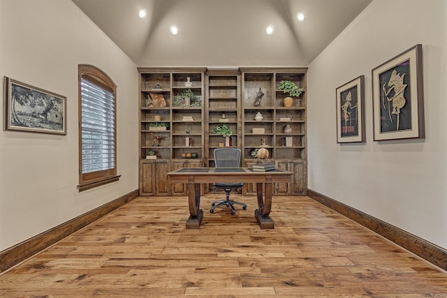 office area featuring high vaulted ceiling, light wood-style flooring, baseboards, and recessed lighting