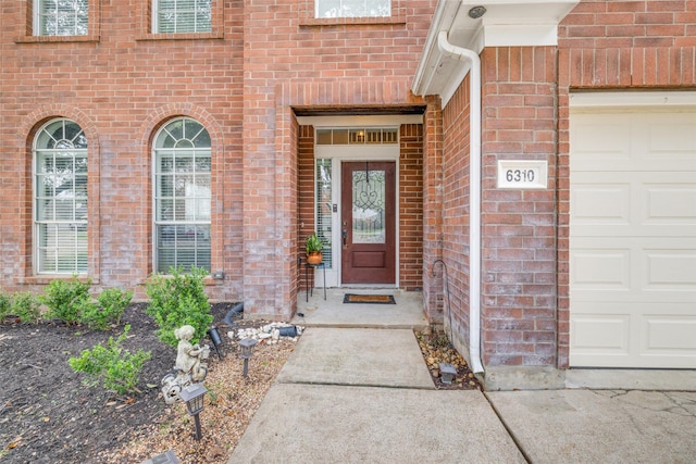 entrance to property featuring a garage