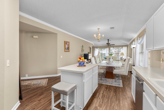 kitchen with white cabinetry, wood-type flooring, and a center island