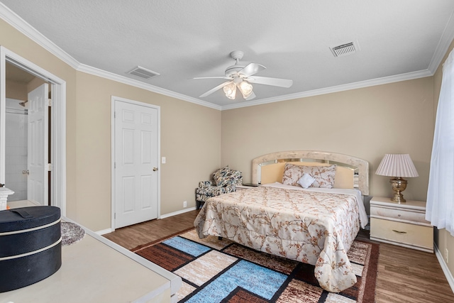 bedroom with hardwood / wood-style flooring, ceiling fan, and crown molding