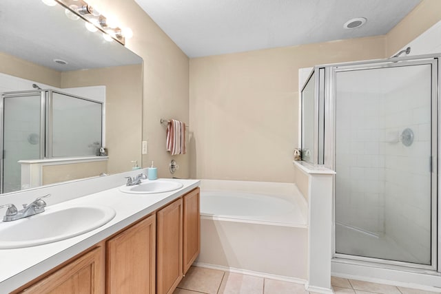 bathroom with tile patterned flooring, vanity, and independent shower and bath