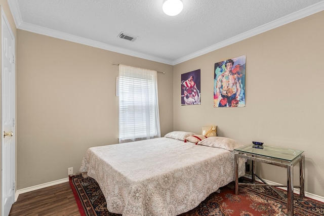 bedroom with ornamental molding, dark hardwood / wood-style floors, and a textured ceiling