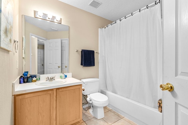 full bathroom with shower / tub combo, vanity, a textured ceiling, tile patterned floors, and toilet