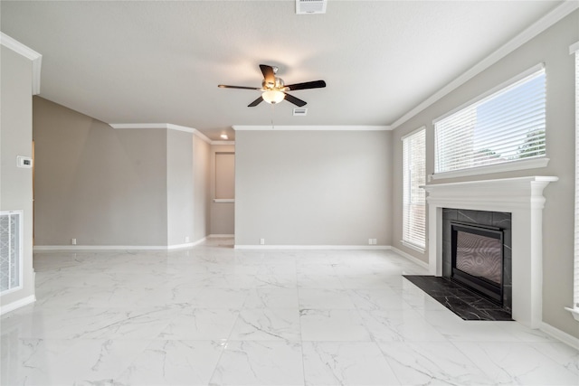 unfurnished living room featuring marble finish floor, ornamental molding, a tile fireplace, and baseboards