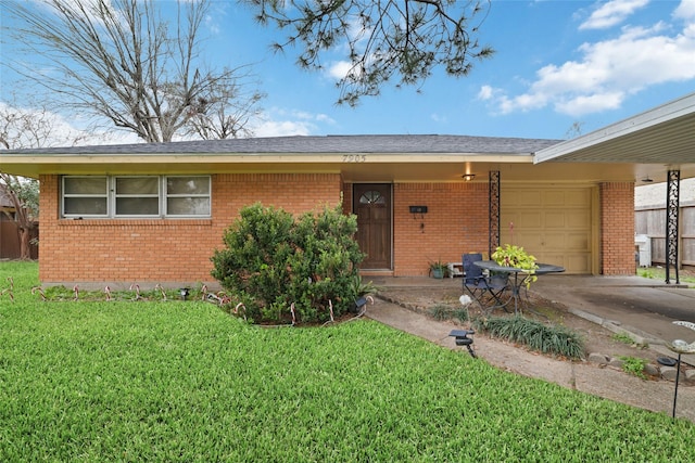 ranch-style home with a garage and a front lawn