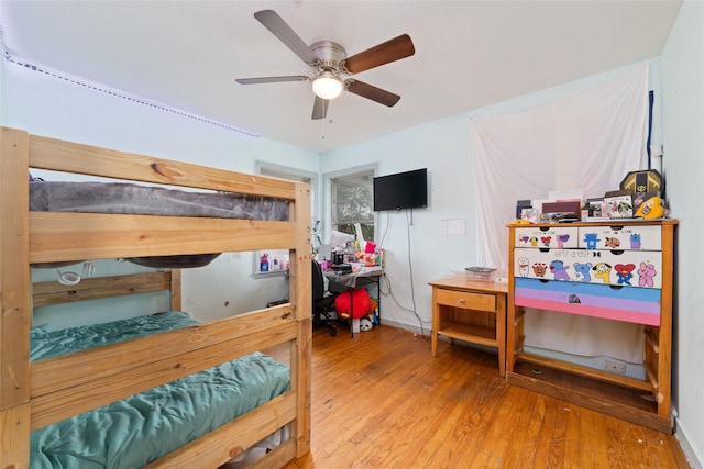 bedroom featuring hardwood / wood-style floors and ceiling fan