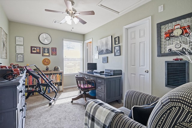 carpeted office space featuring ceiling fan