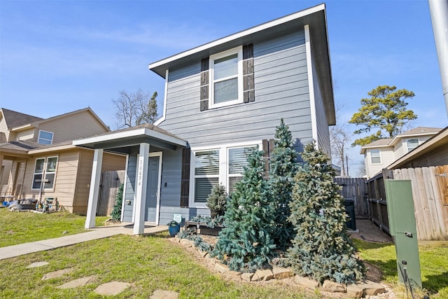 back of house featuring a yard