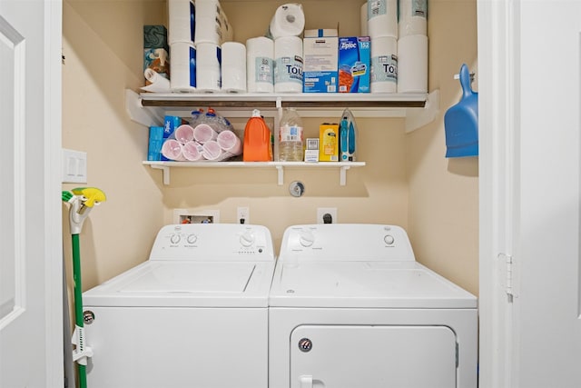 washroom featuring washer and clothes dryer