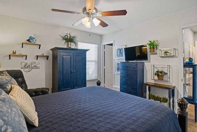 bedroom with ceiling fan and wood-type flooring