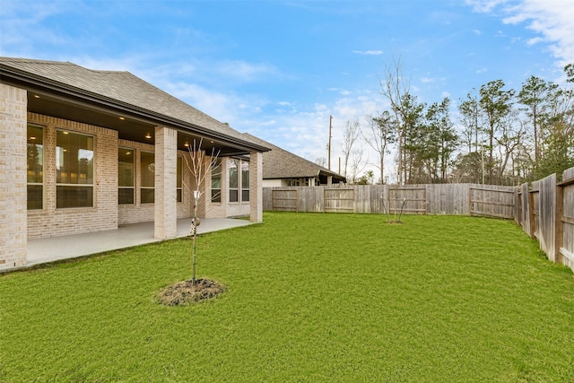 view of yard featuring a patio area and a fenced backyard