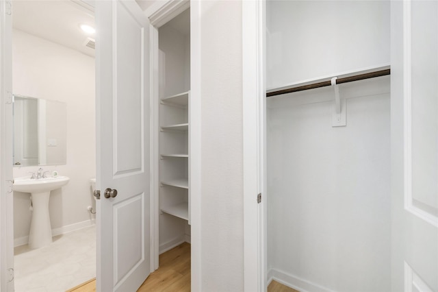 closet featuring visible vents