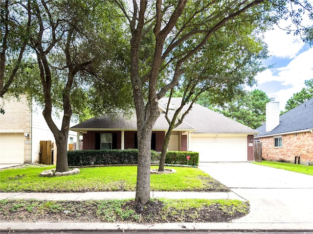 ranch-style house featuring a garage and a front yard