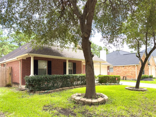 single story home featuring a front yard