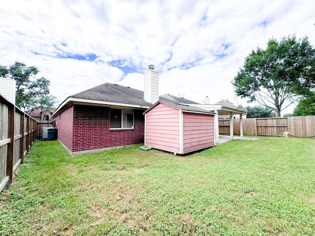 back of house with a yard