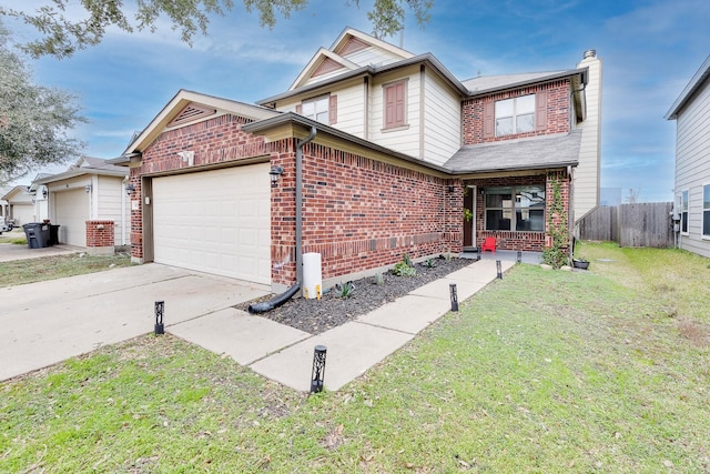 view of front of home featuring a garage and a front lawn