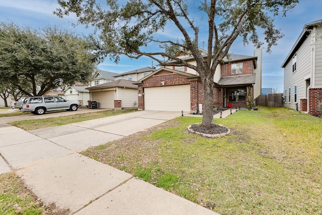 view of front of home with a garage and a front lawn