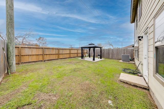 view of yard with cooling unit and a gazebo