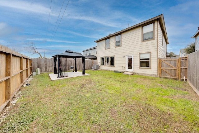 back of house with a gazebo, a yard, a patio, and central air condition unit