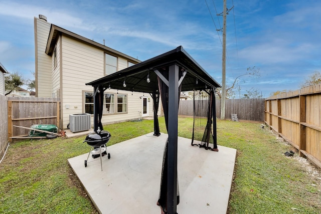 view of patio featuring cooling unit and a gazebo