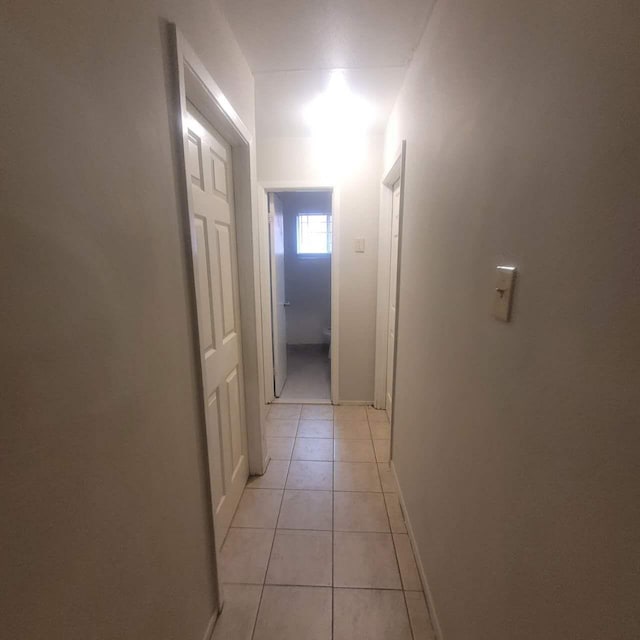 hallway featuring light tile patterned flooring