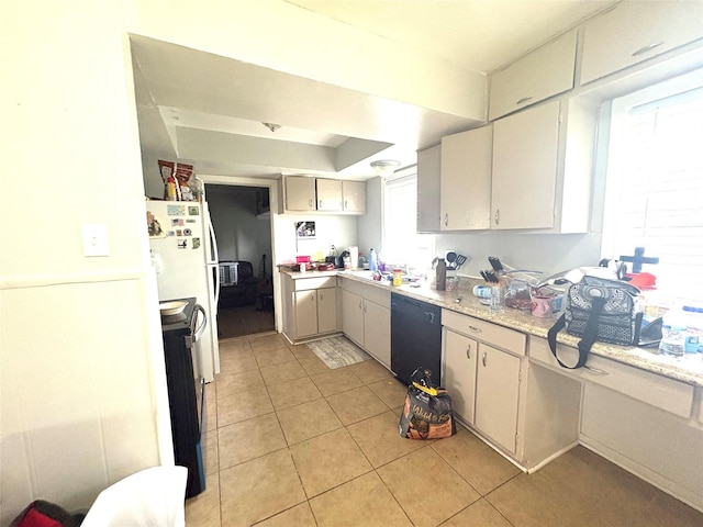 kitchen with light tile patterned floors and black appliances