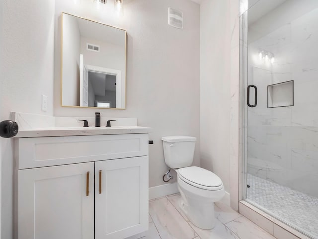 bathroom featuring vanity, an enclosed shower, and toilet