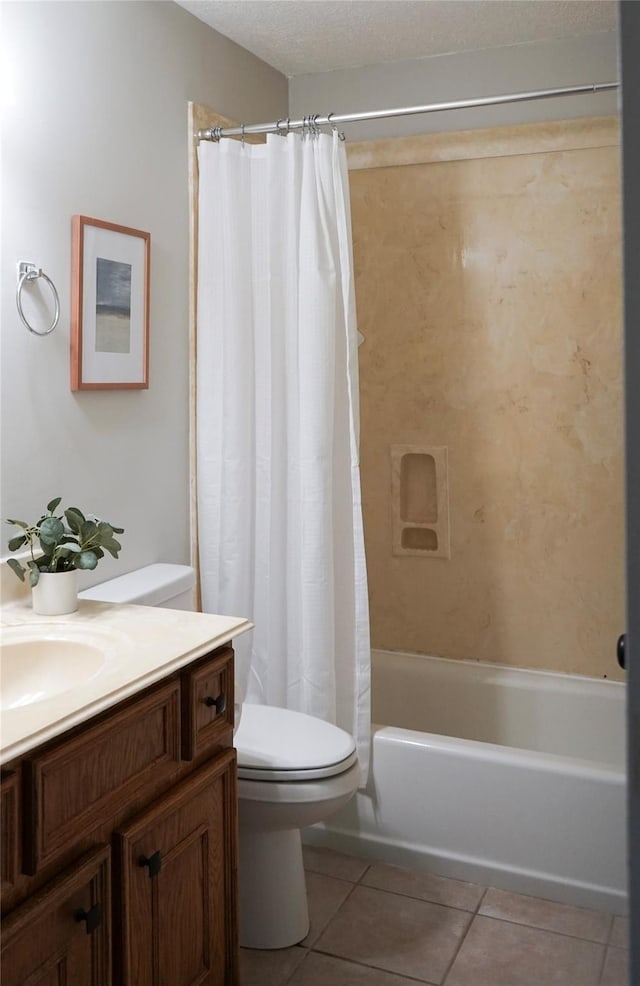 full bathroom featuring vanity, a textured ceiling, tile patterned flooring, toilet, and shower / tub combo with curtain