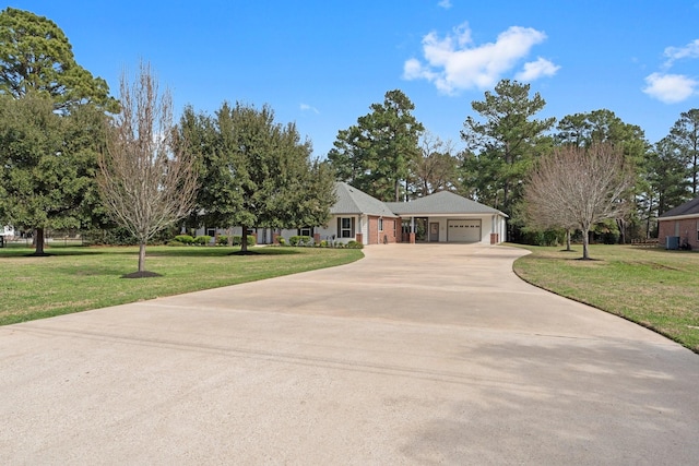 single story home featuring a garage, central AC unit, and a front yard