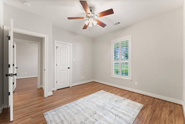 interior space featuring hardwood / wood-style flooring and ceiling fan