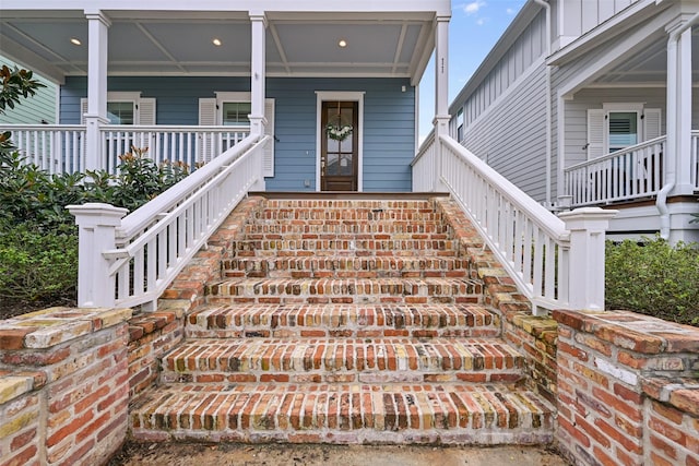 entrance to property featuring a porch