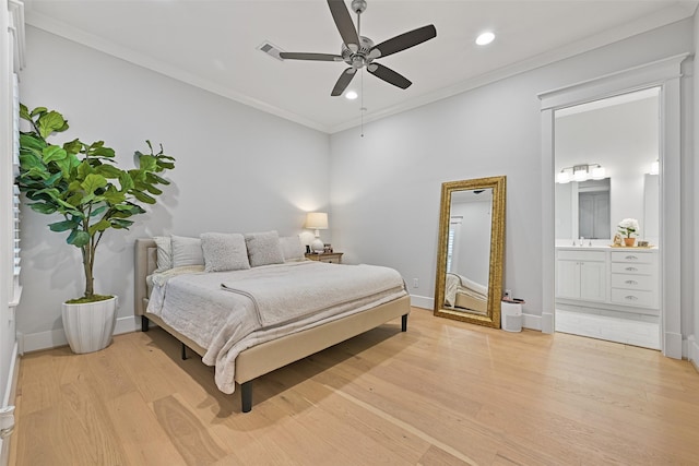 bedroom with crown molding, ceiling fan, connected bathroom, and light hardwood / wood-style floors