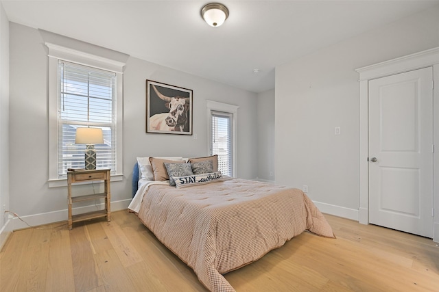 bedroom with light hardwood / wood-style floors