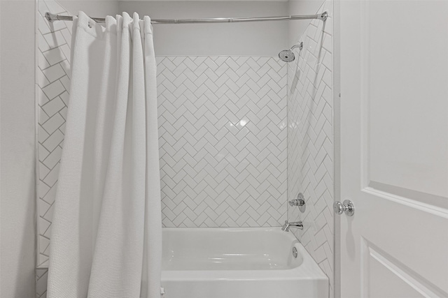 bathroom with shower / bath combo with shower curtain