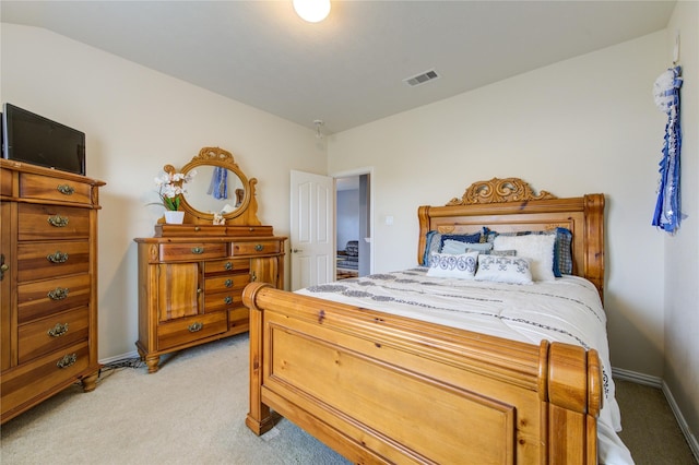 bedroom featuring baseboards, visible vents, and light colored carpet