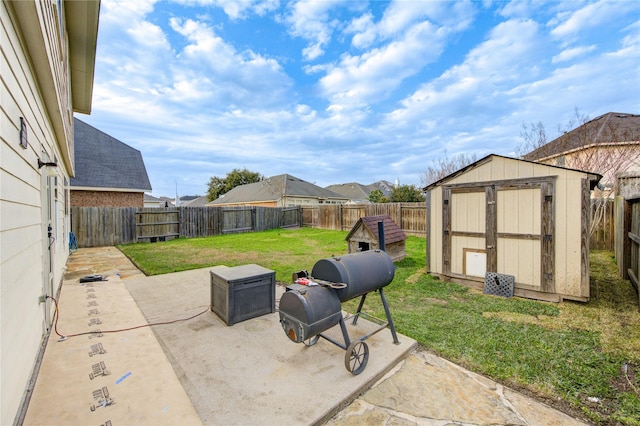 view of patio / terrace featuring a shed, an outdoor structure, and a fenced backyard