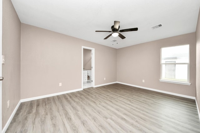 5879 Belcrest St, Houston, TX 77033 - empty room featuring a ceiling fan and wood finished floors