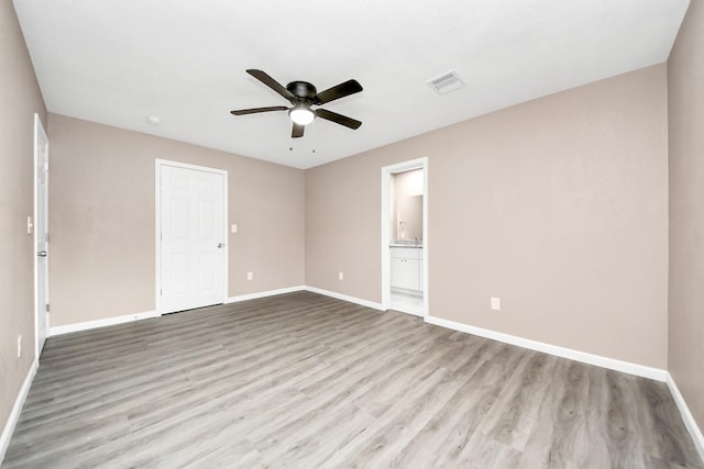 5879 Belcrest St, Houston, TX 77033 - spare room with a ceiling fan and wood finished floors