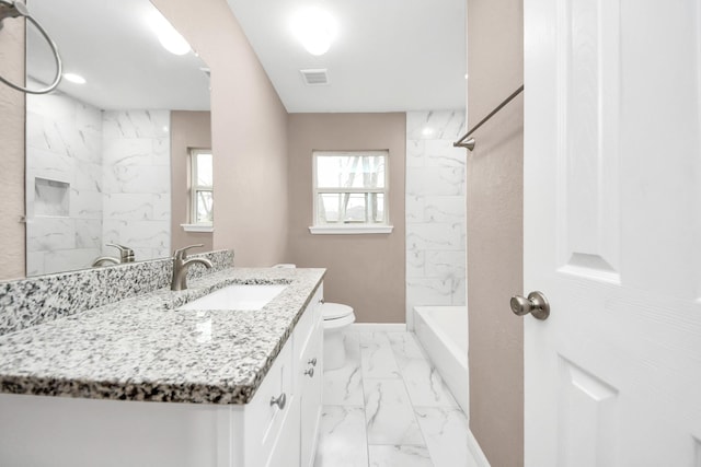5879 Belcrest St, Houston, TX 77033 - bathroom with marble finish flooring, vanity, and tub / shower combination