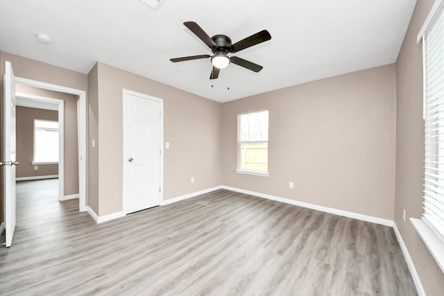 5879 Belcrest St, Houston, TX 77033 - unfurnished bedroom with wood finished floors, ceiling fan, and a closet