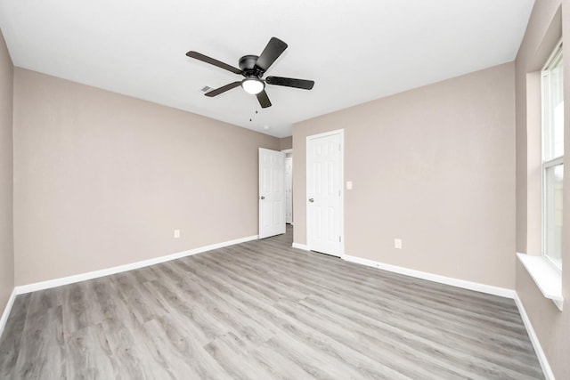 5879 Belcrest St, Houston, TX 77033 - unfurnished room featuring wood finished floors and a ceiling fan
