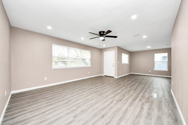 5879 Belcrest St, Houston, TX 77033 - unfurnished living room with ceiling fan, wood finished floors, and recessed lighting