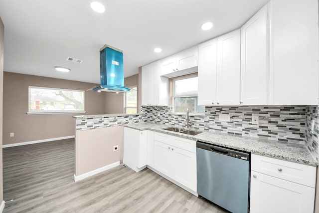 5879 Belcrest St, Houston, TX 77033 - kitchen with dishwasher, backsplash, white cabinets, light wood-type flooring, and recessed lighting