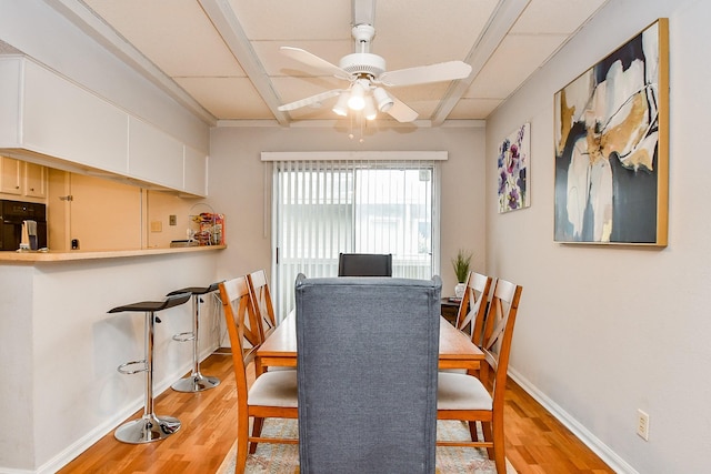 dining space featuring ceiling fan and light hardwood / wood-style floors