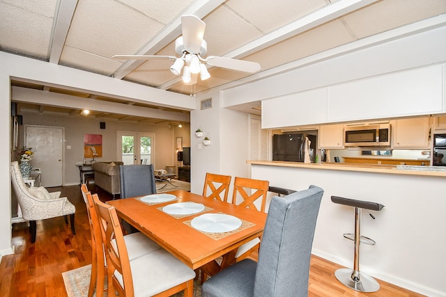 dining area featuring light hardwood / wood-style flooring, french doors, and ceiling fan