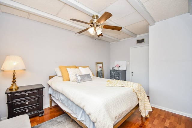 bedroom featuring dark hardwood / wood-style floors and ceiling fan