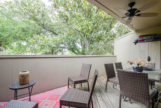 wooden terrace featuring ceiling fan